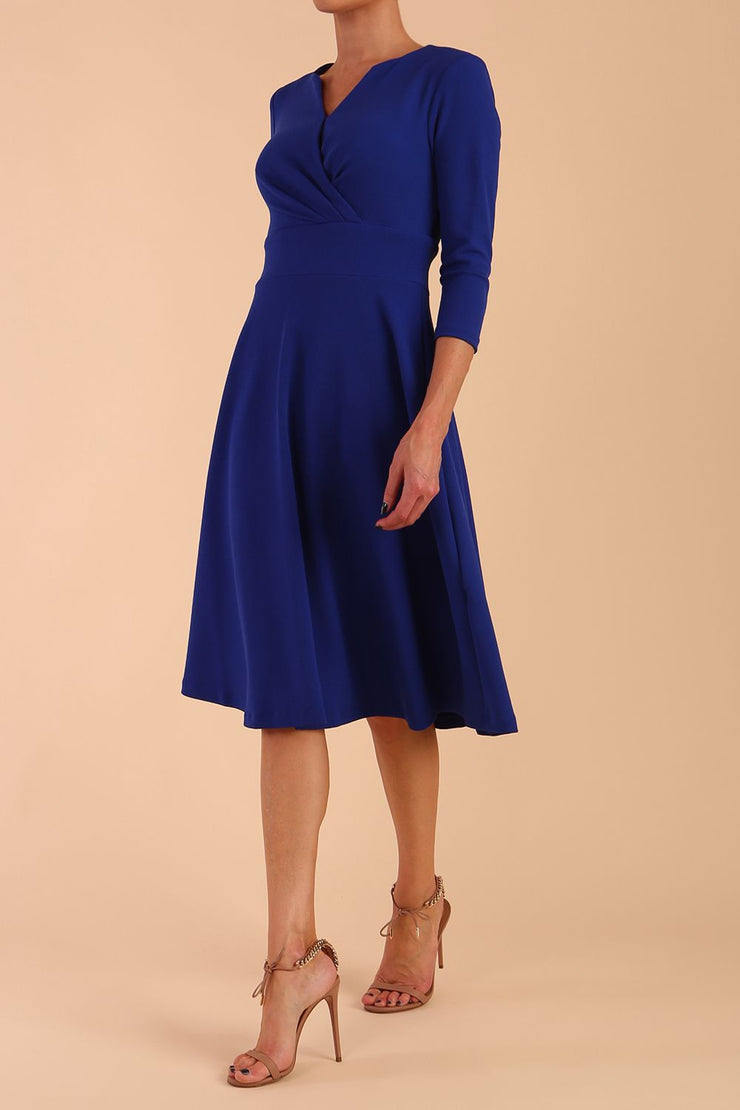  model is wearing diva catwalk january sleeved a-line v-neck dress in royal blue front