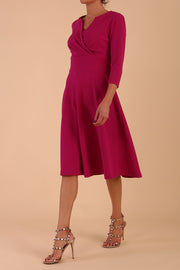 model is wearing diva catwalk january 3/4 sleeves a-line v-neck swing dress in magenta front side