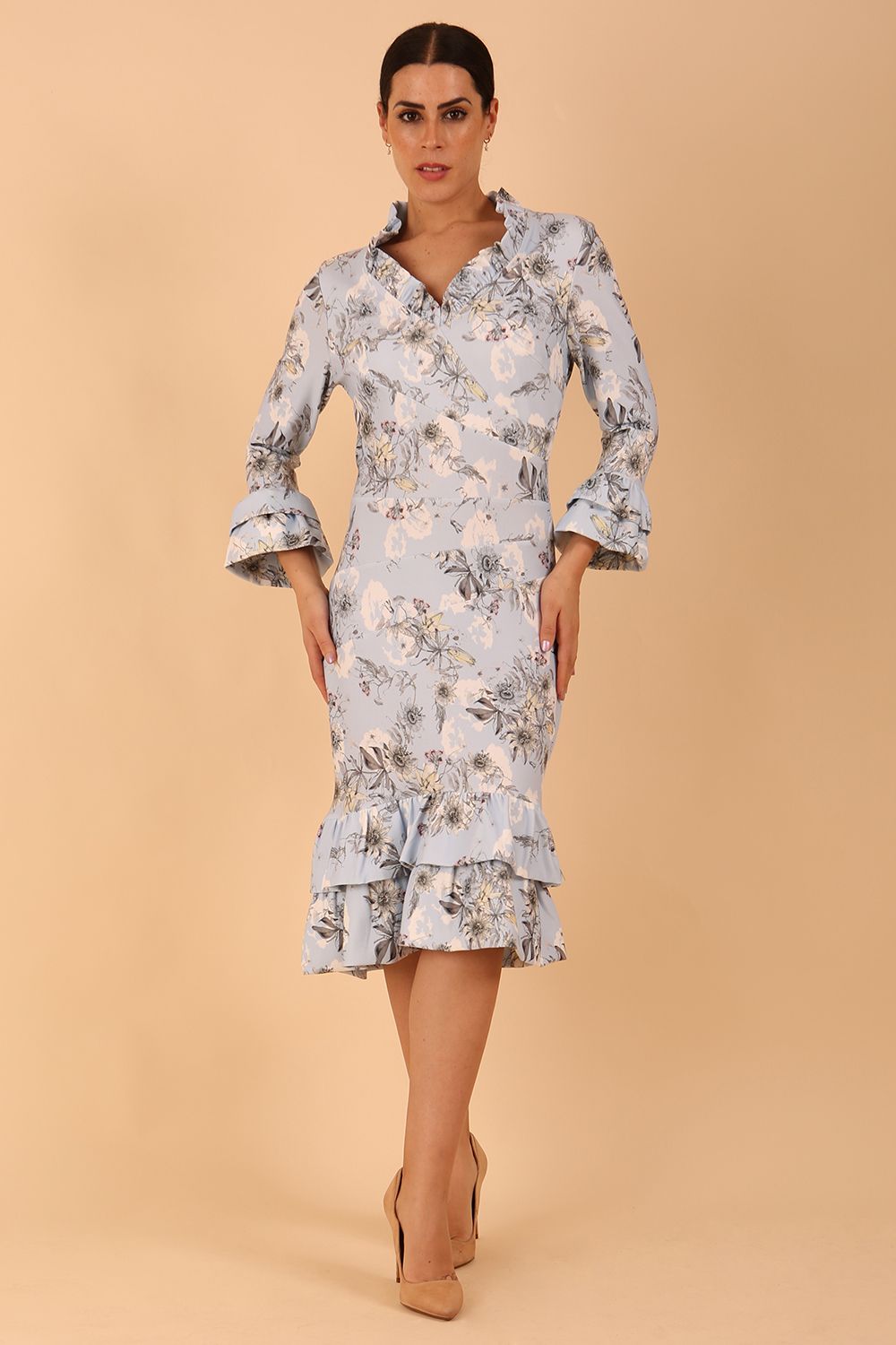 model is wearing diva catwalk fern printed dress with rushes and sleeves in light blue front