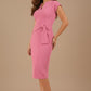 Woman wearing a pink dress with a belt against a beige background (Cashmere Pink)