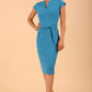 model is wearing diva catwalk Ester cap sleeve pencil dress with v-neck and bow detail at the front in malibu blue front
