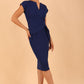 model is wearing diva catwalk Ester cap sleeve pencil dress with v-neck and bow detail at the front in midnight blue front