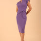 model is wearing diva catwalk Ester cap sleeve pencil dress with v-neck and bow detail at the front in lavender purple front