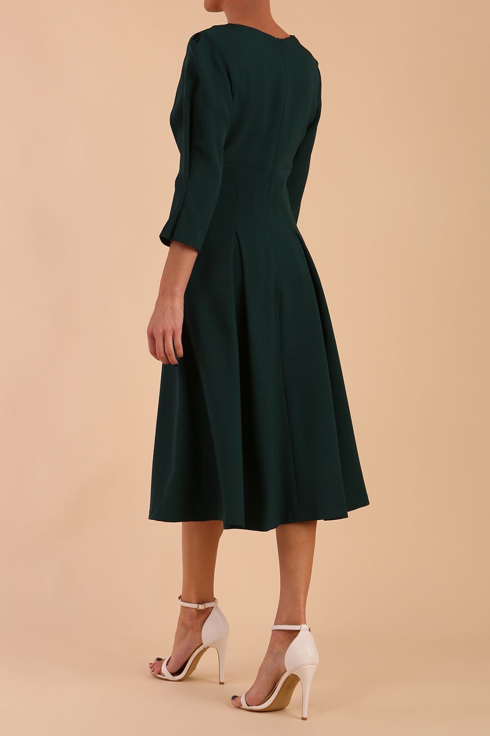 model is wearing diva catwalk harpsden a-line skirt 3/4 sleeve swing dress with rounded neckline in forest green back