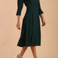 model is wearing diva catwalk harpsden a-line skirt 3/4 sleeve swing dress with rounded neckline in forest green front