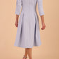 model is wearing diva catwalk harpsden a-line skirt 3/4 sleeve swing dress with rounded neckline in Celestial Blue back