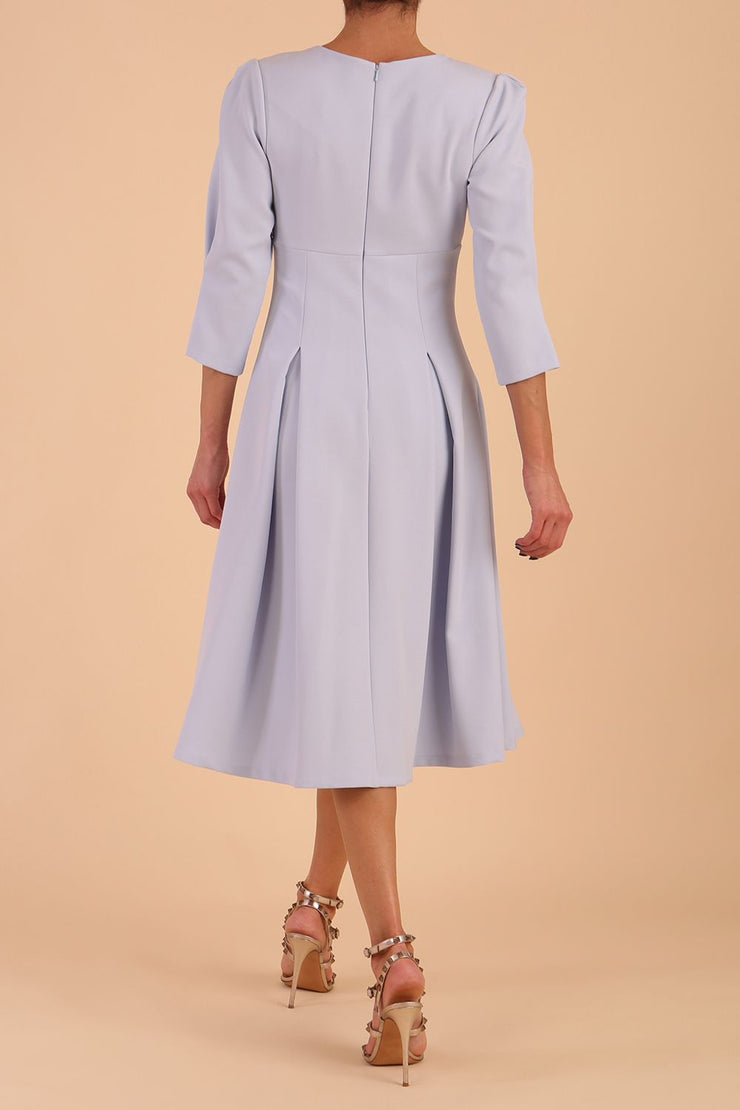 model is wearing diva catwalk harpsden a-line skirt 3/4 sleeve swing dress with rounded neckline in Celestial Blue back