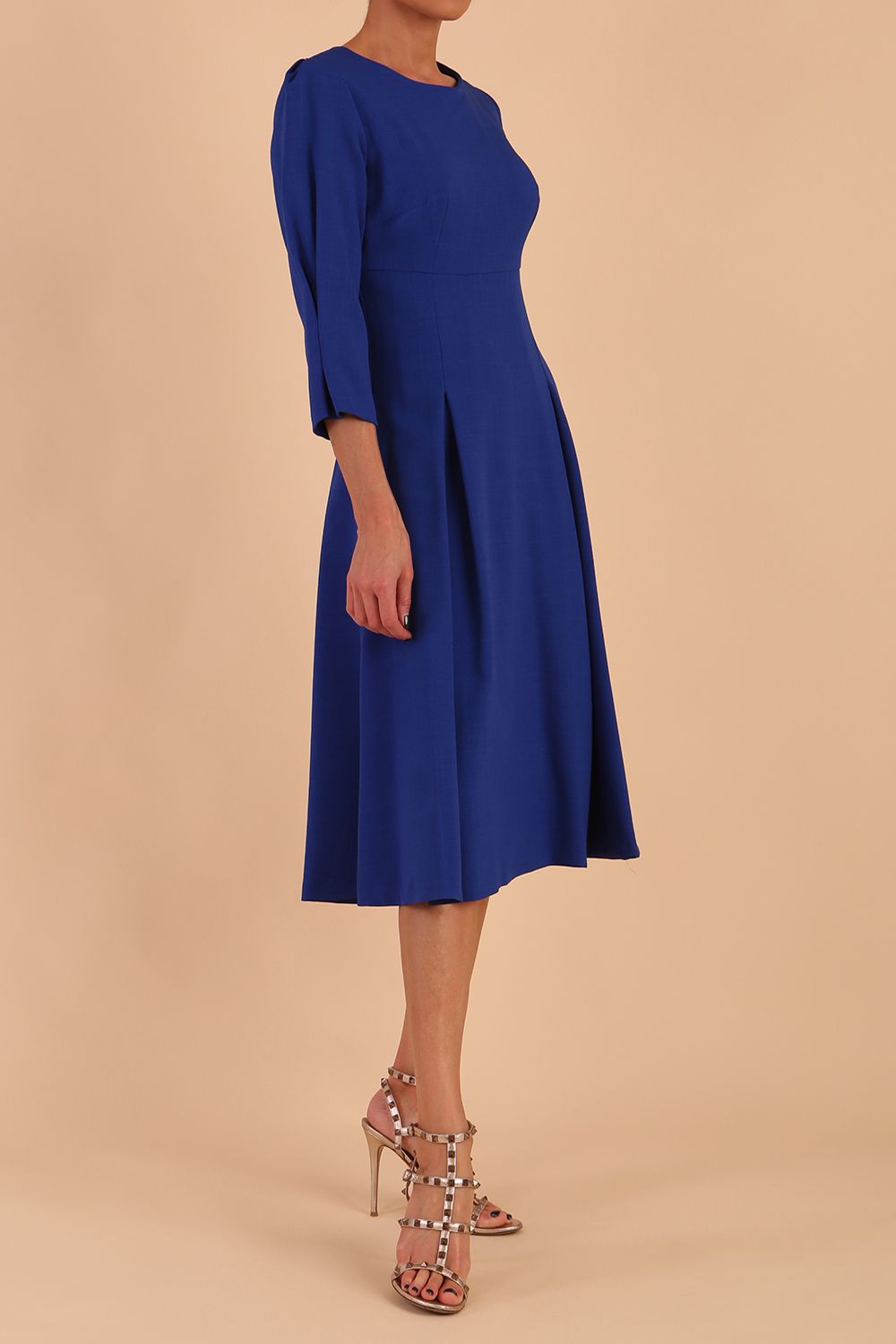 blonde model is wearing diva catwalk harpsden a-line skirt 3/4 sleeve swing dress with rounded neckline in cobalt blue front