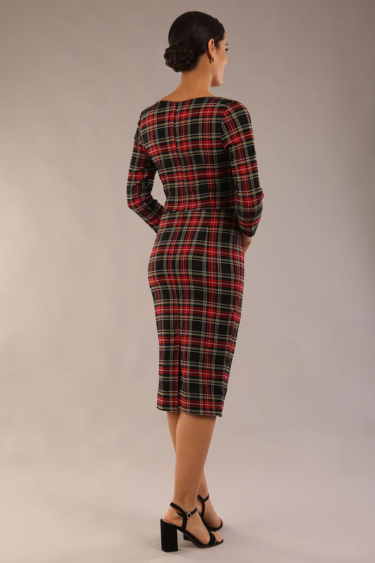 model is wearing a diva catwalk Horizon Tartan Stretch Pencil Dress with crossover v neckline and 3/4 sleeves and pleating details and knee length in luxury tartan stretch fabric in Royal Red Tartan