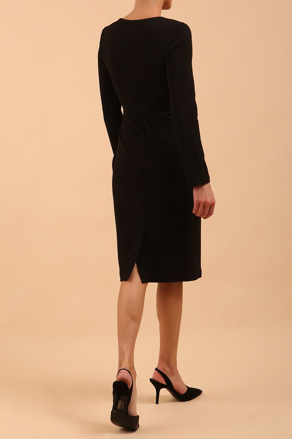 model is wearing diva catwalk gately pencil dress with long sleeves and twisted low v-neck in black back