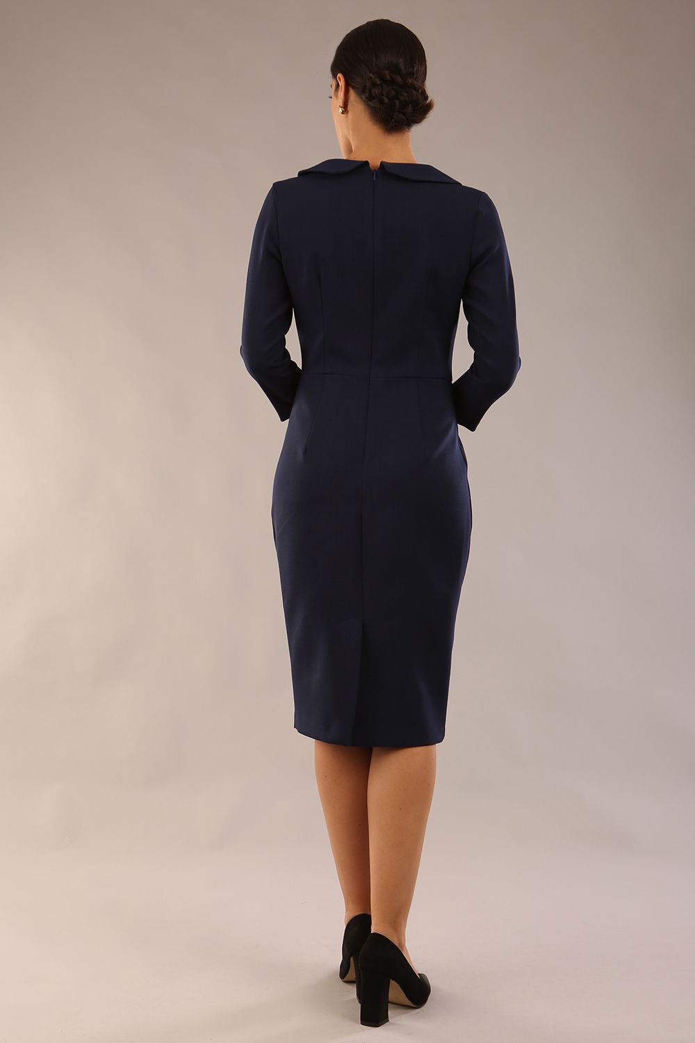 model wearing a diva catwalk  Helium 3/4 Sleeved Pencil Dress with 3/4 sleeve and knee length and bow detail on the neckline in navy blue colour back