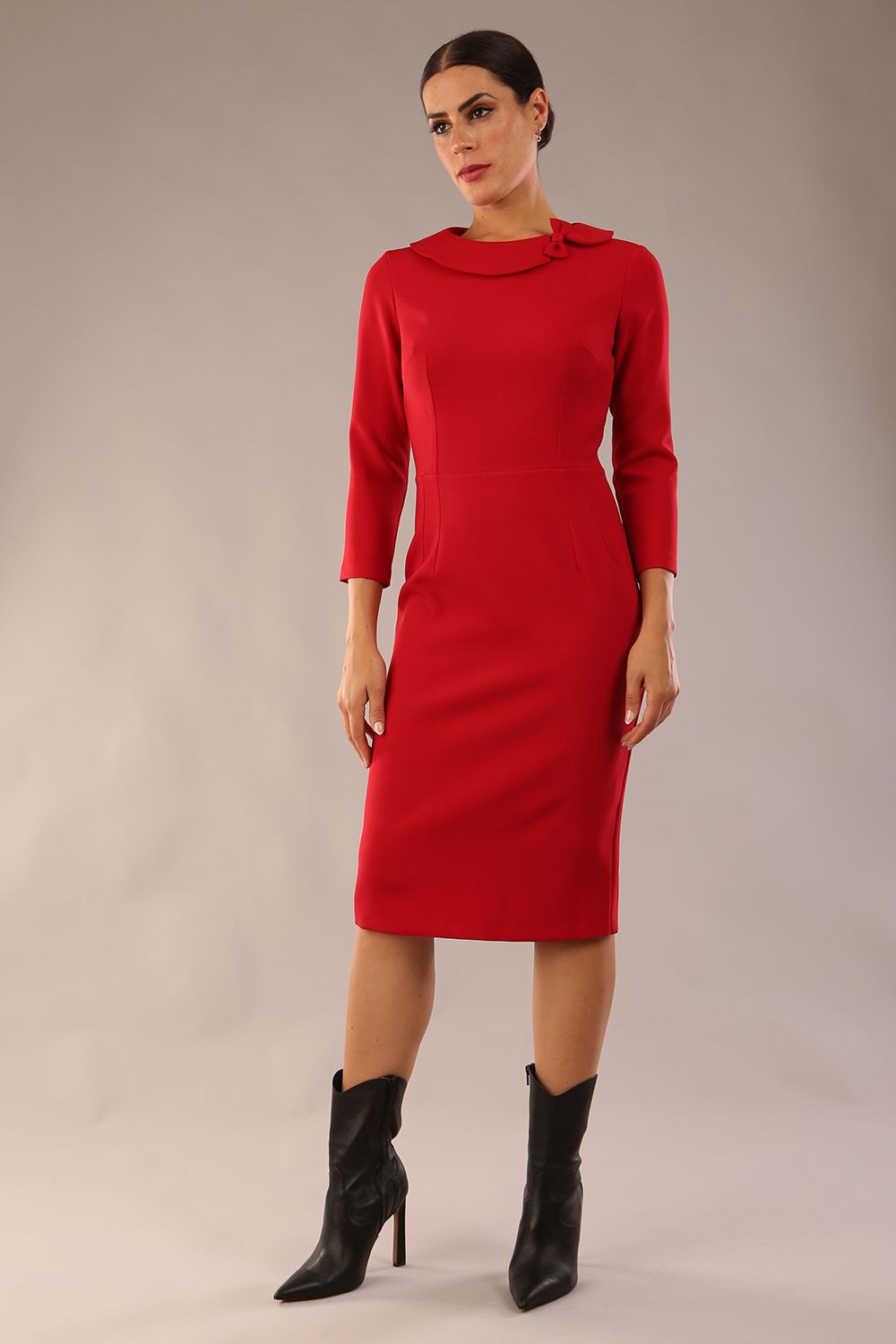 model wearing a diva catwalk  Helium 3/4 Sleeved Pencil Dress with 3/4 sleeve and knee length and bow detail on the neckline in dark red colour