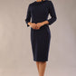 model wearing a diva catwalk  Helium 3/4 Sleeved Pencil Dress with 3/4 sleeve and knee length and bow detail on the neckline in navy blue colour front