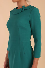 Model wearing diva catwalk Helium Sleeved pencil skirt dress in Parasailing Green