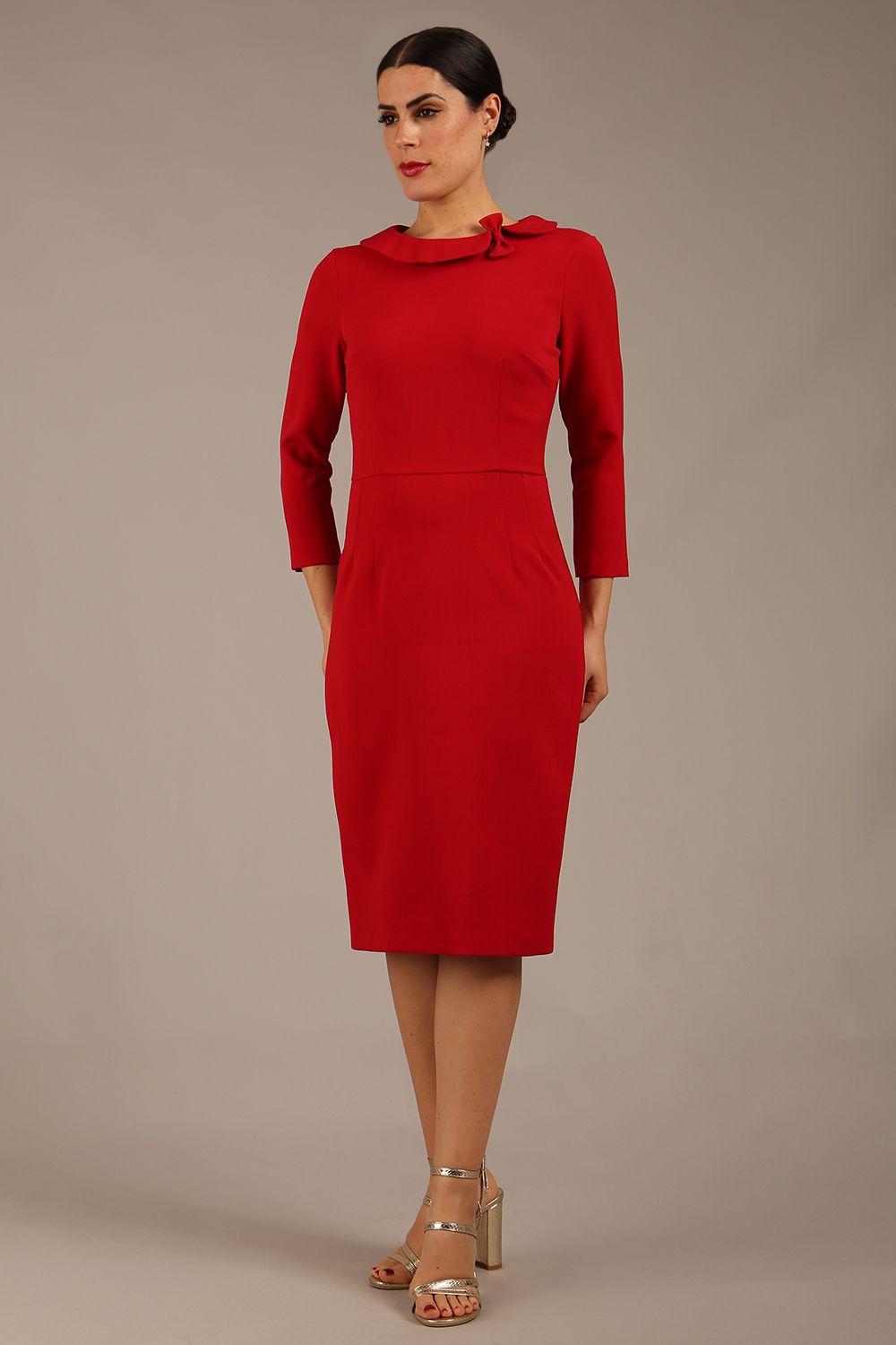 brunette model is wearing a diva catwalk  Helium 3/4 Sleeved Pencil Dress with 3/4 sleeve and knee length and bow detail on the neckline in dark red colour front 