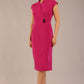 brunette Model is wearing a diva catwalk Derby pencil skirt dress cap sleeves with buttons details at the waistband and star neckline below the knee length with pockets in magenta colour front image 