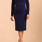 model wearing a diva catwalk Olgivy Long Sleeve Knee Length Pencil Dress round neckline and long sleeve in navy blue colour