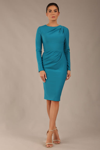 model wearing a diva catwalk Olgivy Long Sleeve Knee Length Pencil Dress round neckline and long sleeve in magic blue colour front