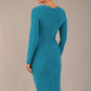 model wearing a diva catwalk Olgivy Long Sleeve Knee Length Pencil Dress round neckline and long sleeve in magic blue colour back
