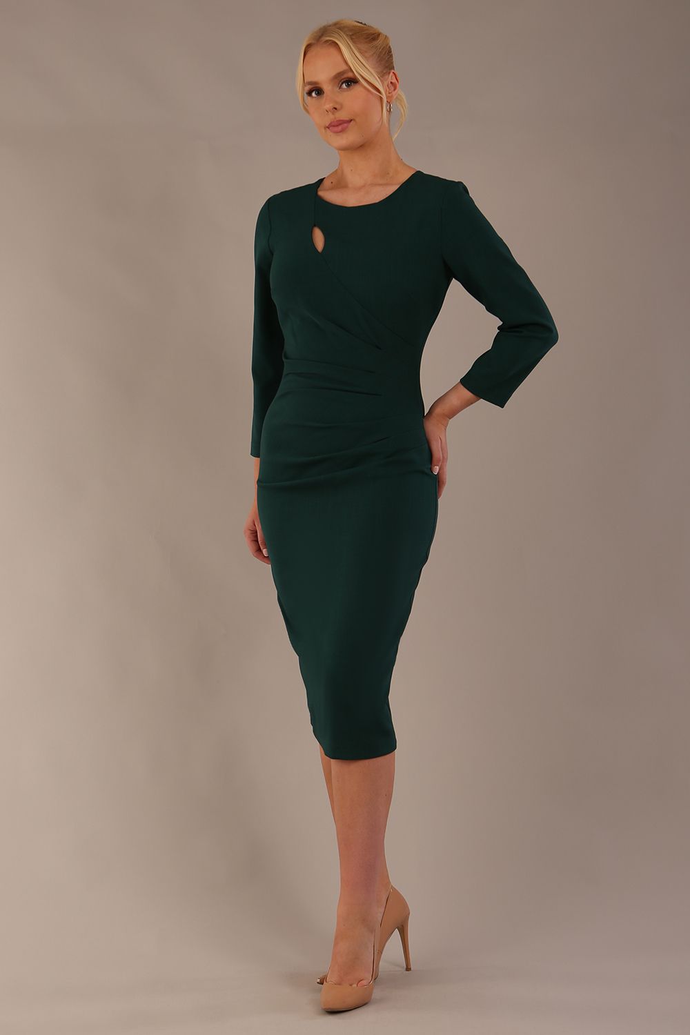 model is wearing diva catwalk miracle pencil dress with keyhole detail on a side of the front panel and gathering detail on a side or bodice panel with sleeves in forest green colour front (Forest Green)