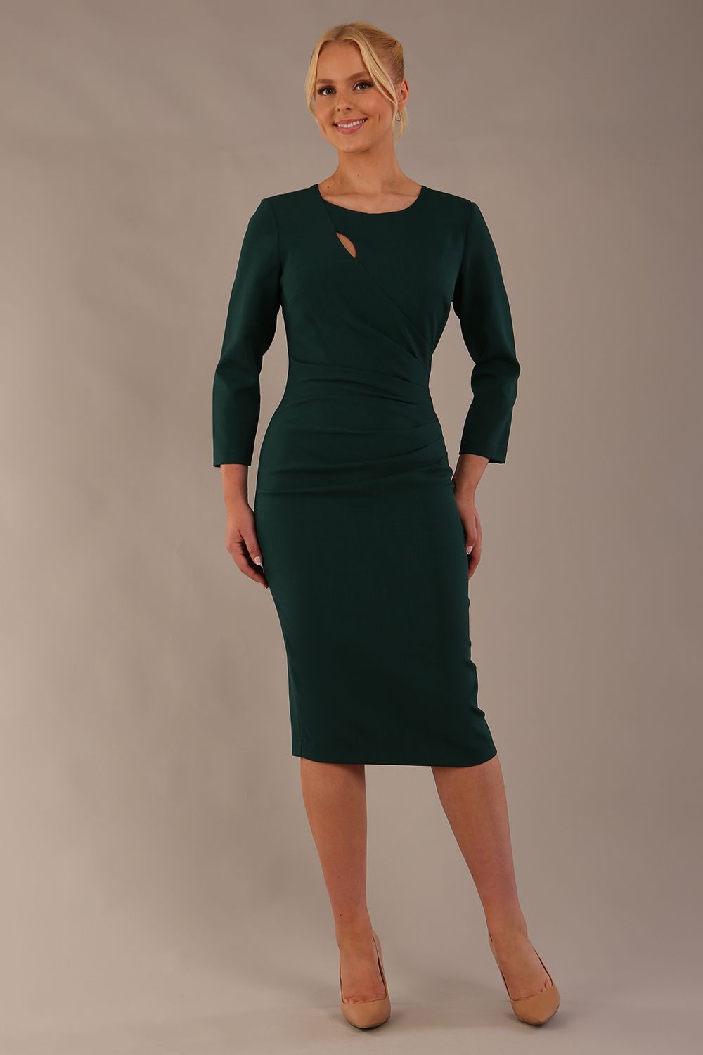 model is wearing diva catwalk miracle pencil dress with keyhole detail on a side of the front panel and gathering detail on a side or bodice panel with sleeves in forest green colour back (Forest Green)