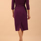 model is wearing diva catwalk lauren odd shoulder asymmetric neckline pencil dress with sleeves in imperial purple back