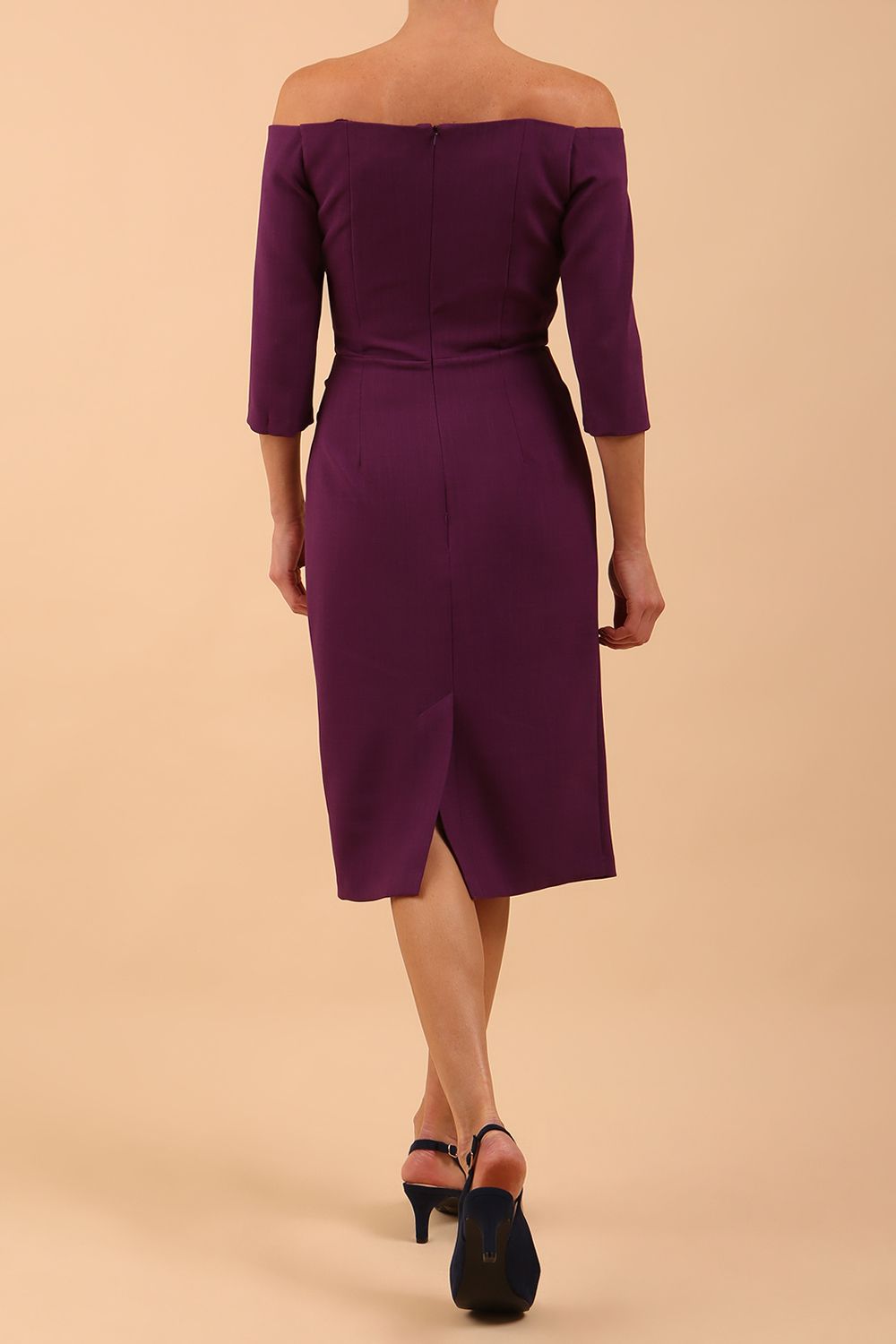 model is wearing diva catwalk lauren odd shoulder asymmetric neckline pencil dress with sleeves in imperial purple back