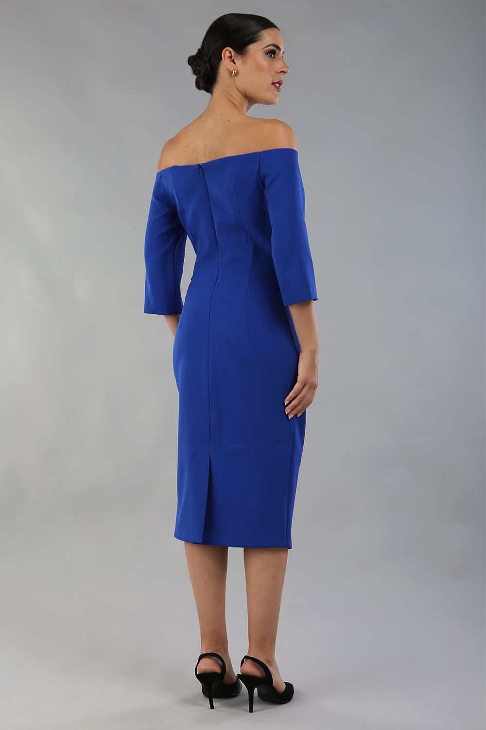 model is wearing diva catwalk lauren odd shoulder asymmetric neckline pencil dress with sleeves in cobalt blue back