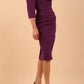 model is wearing diva catwalk lauren odd shoulder asymmetric neckline pencil dress with sleeves in imperial purple front side