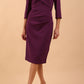 model is wearing diva catwalk lauren odd shoulder asymmetric neckline pencil dress with sleeves in imperial purple front