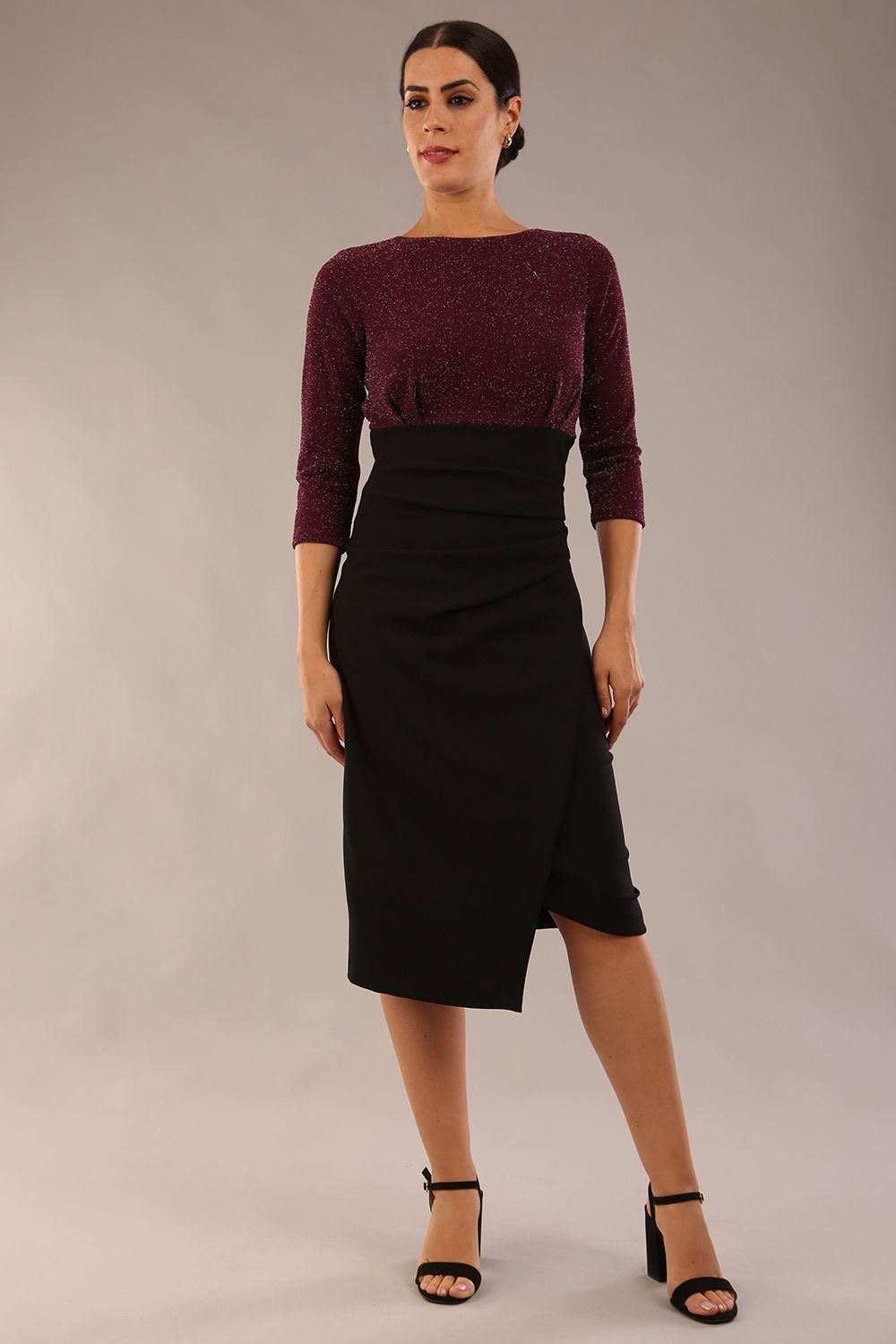 model is wearing diva catwalk contrast pencil dress with sleeve and assymetric skirt detail in black and burgundy sparkle front side