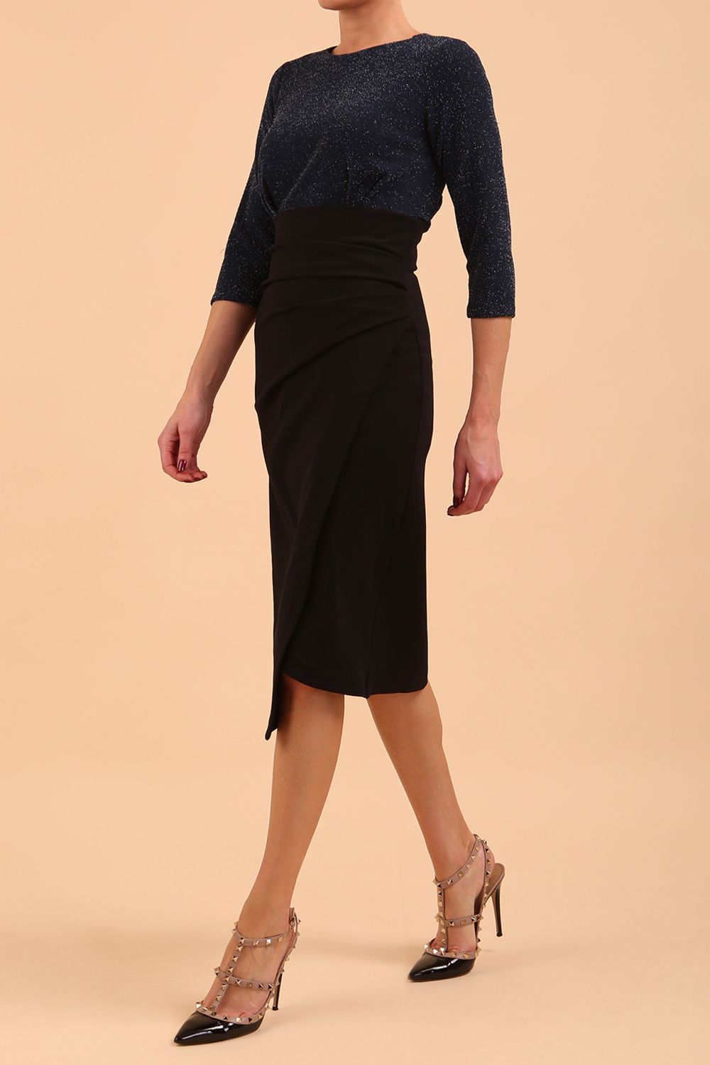 model is wearing diva catwalk contrast pencil dress with sleeve and assymetric skirt detail in black and teal sparkle front