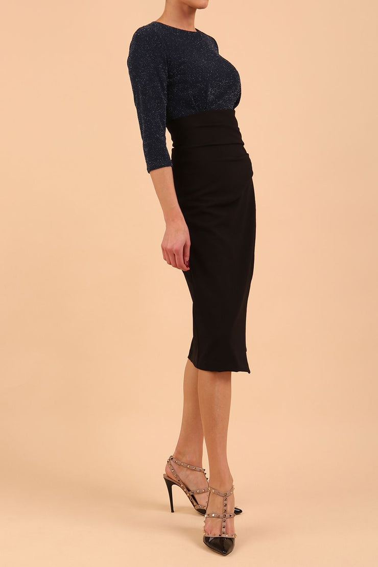 model is wearing diva catwalk contrast pencil dress with sleeve and assymetric skirt detail in black and teal sparkle front