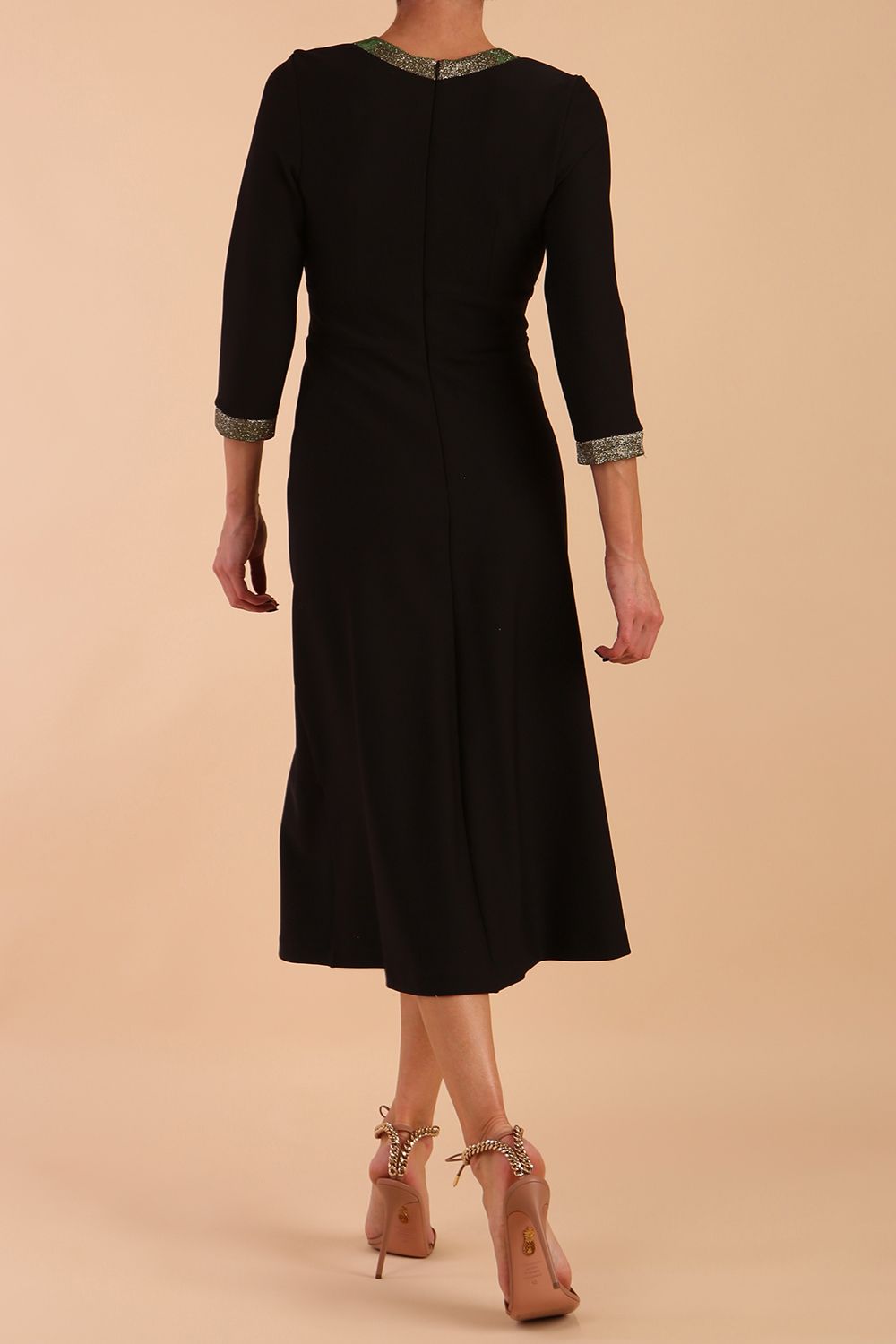 model is wearing diva catwalk carolyn swing midi dress with a band and glitter detail on sleeves and around the neckline in black and sherwood glitter back