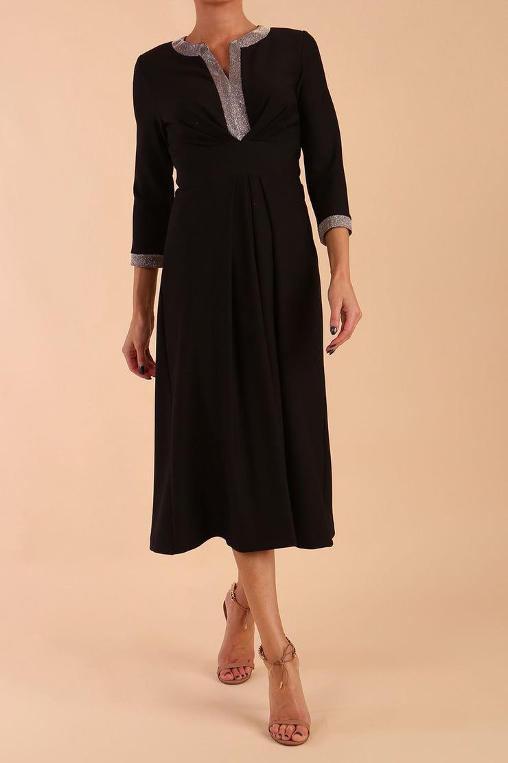model is wearing diva catwalk carolyn swing midi dress with a band and glitter detail on sleeves and around the neckline in black side