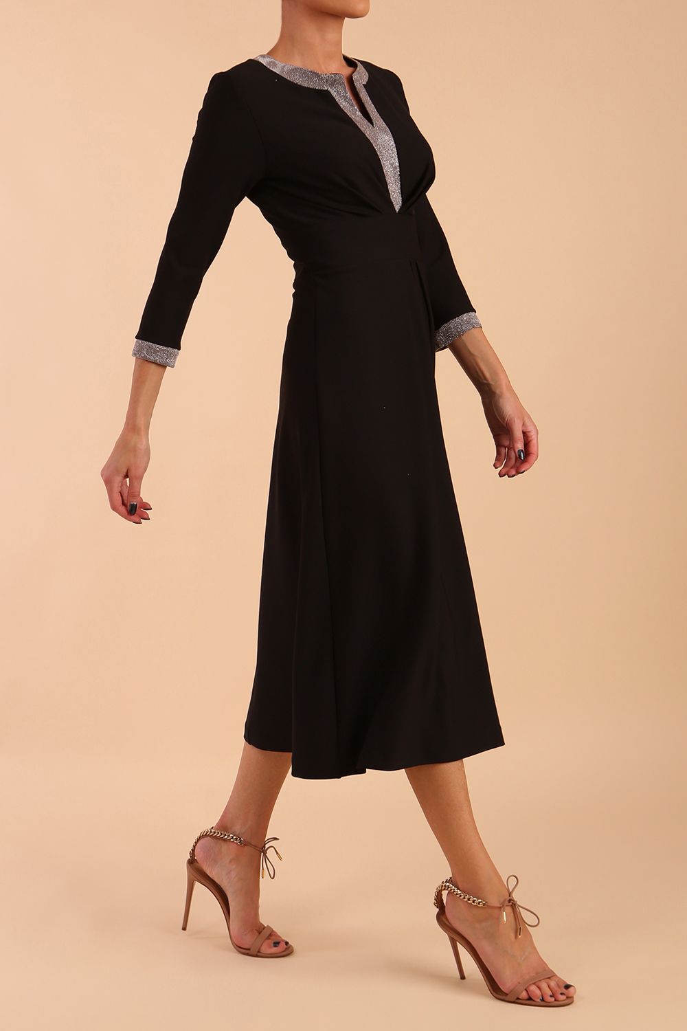 model is wearing diva catwalk carolyn swing midi dress with a band and glitter detail on sleeves and around the neckline in black side