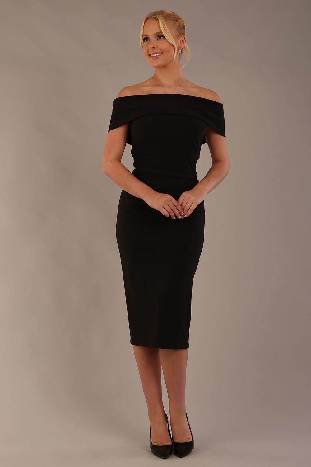 model is wearing diva catwalk amelia pencil dress with bardot neckline and ruched back in black front (Black)