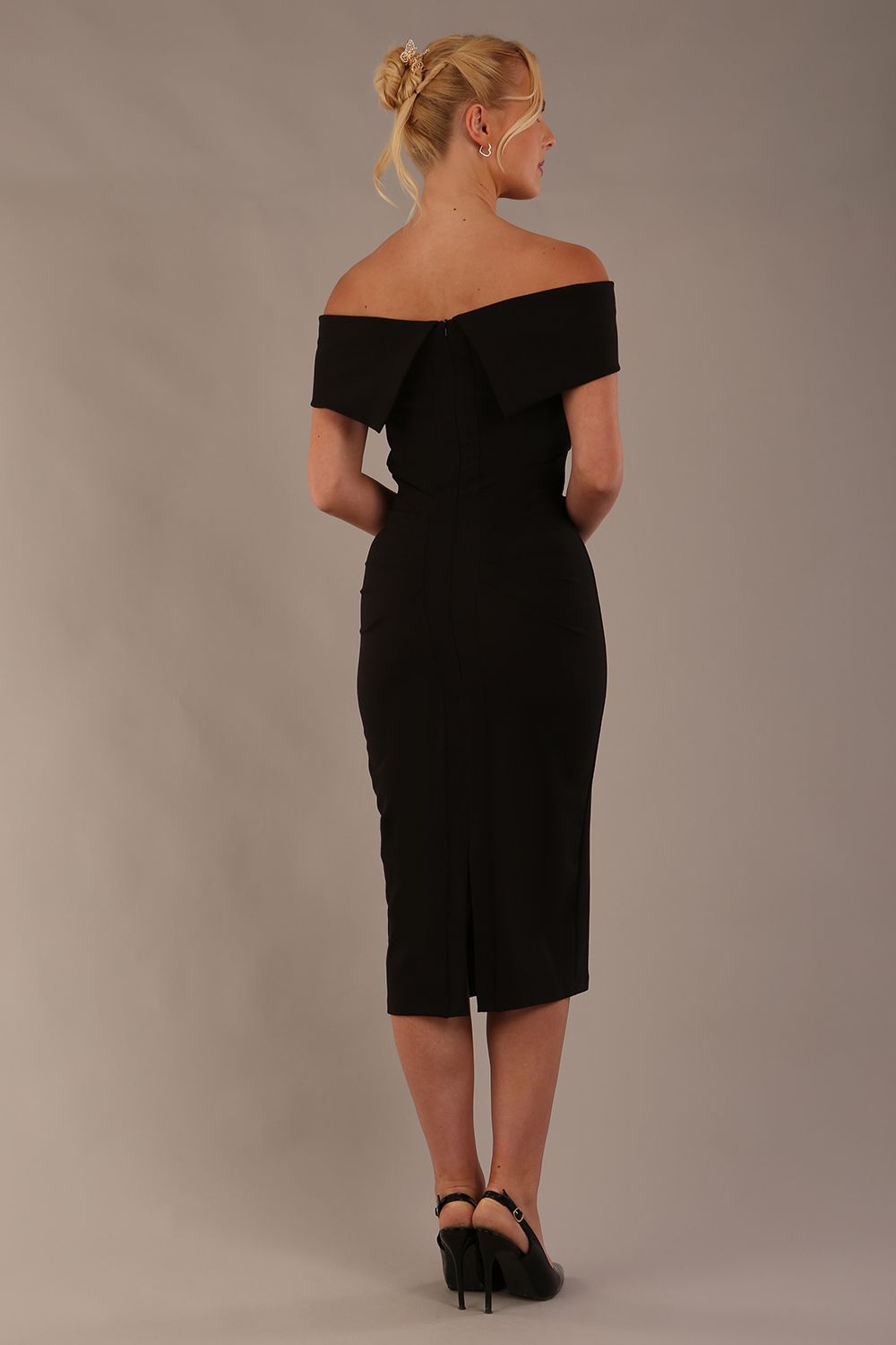 model is wearing diva catwalk amelia pencil dress with bardot neckline and ruched back in black back (Black)