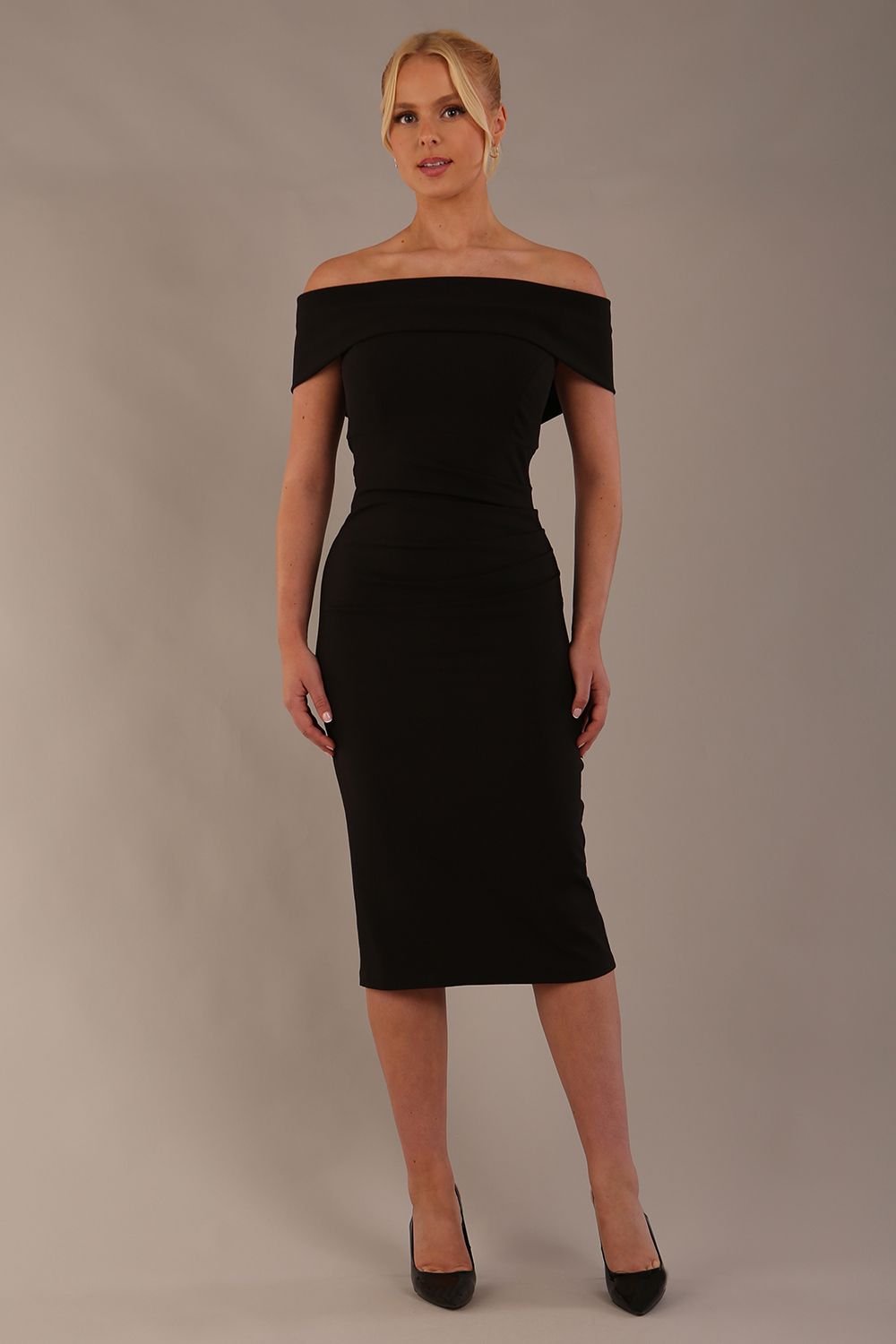 model is wearing diva catwalk amelia pencil dress with bardot neckline and ruched back in black front (Black)