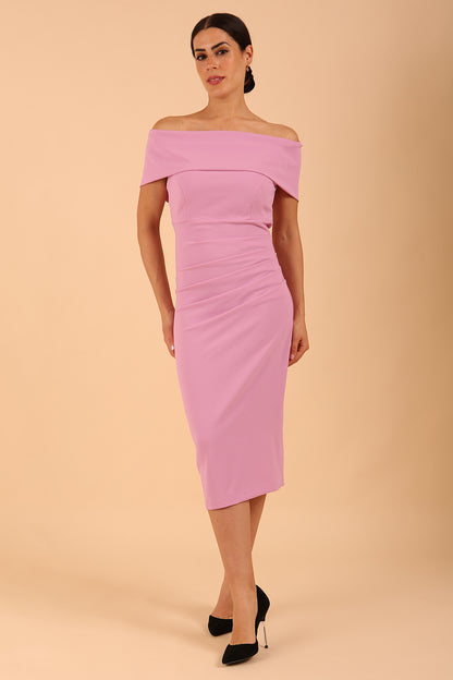 model is wearing diva catwalk amelia pencil dress with bardot neckline and ruched back in Dawn Pink