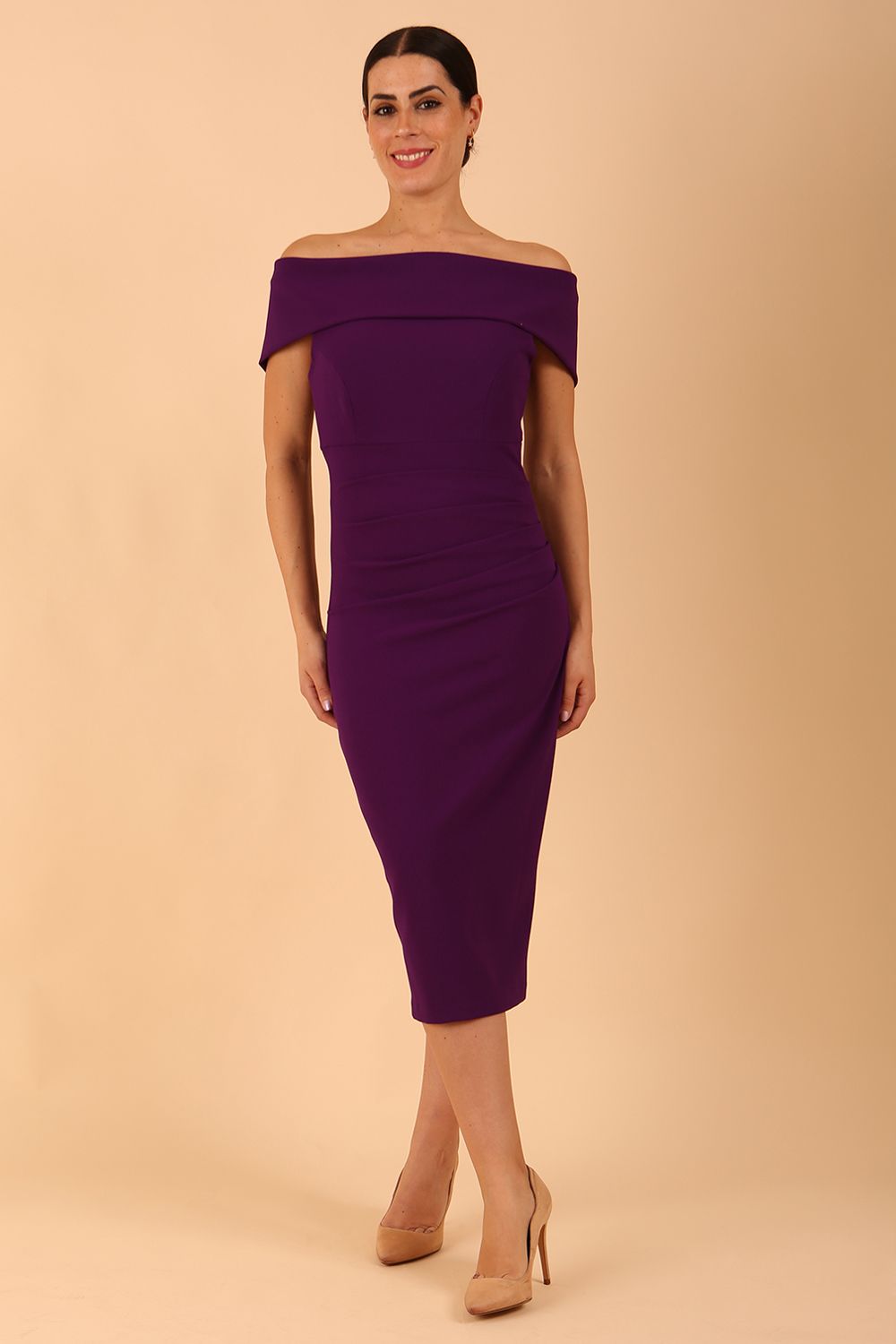 model is wearing diva catwalk amelia pencil dress with bardot neckline and ruched back in Passion Purple front