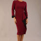 model is wearing diva catwalk bounty contrast pencil dress with rounded neckline and waistband in blissful burgundy and black colours front