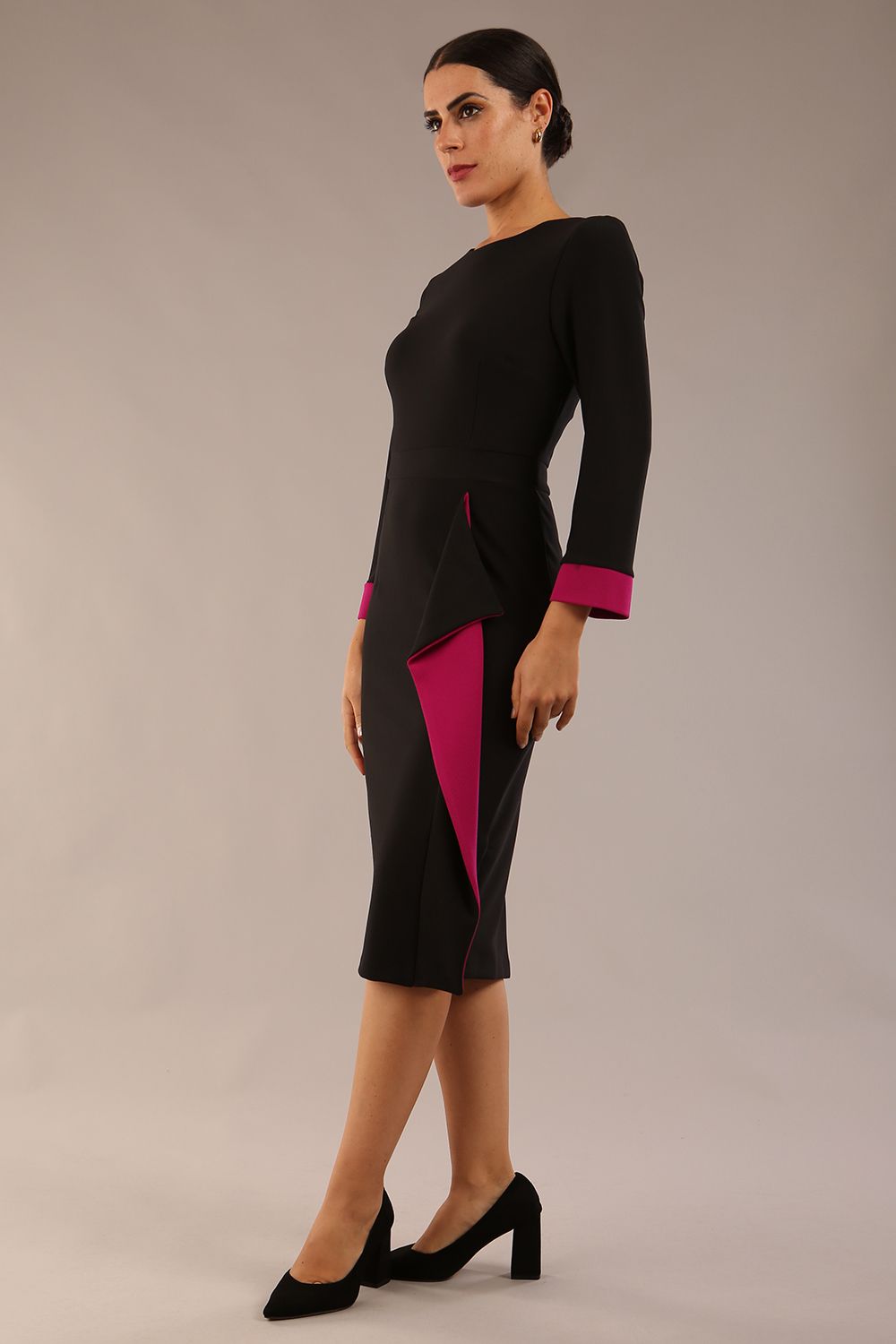 model is wearing diva catwalk bounty contrast pencil dress with rounded neckline and waistband in black and magenta haze colours front side