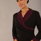 model is wearing diva catwalk osaka black pencil dress with burgundy sparkle contrasting detail on sleeves and v-neckline and knee length