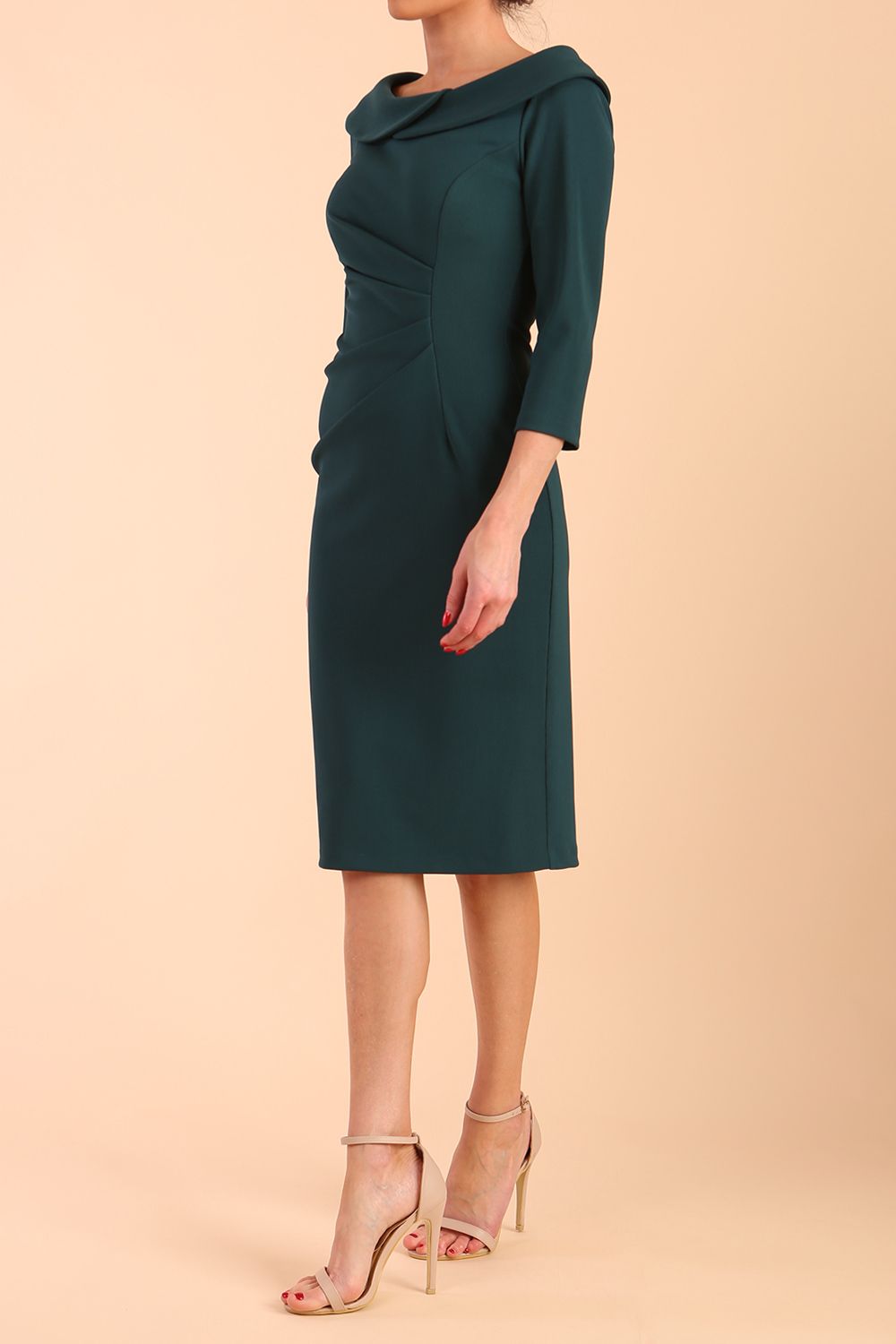 Model wearing diva catwalk Monique 3/4 Sleeve Pencil Dress in Green Gables sideModel wearing diva catwalk Monique 3/4 Sleeve Pencil Dress with Overlapping Folded  Round Neckline and 3/4 sleeves and knee length in Green Gables side