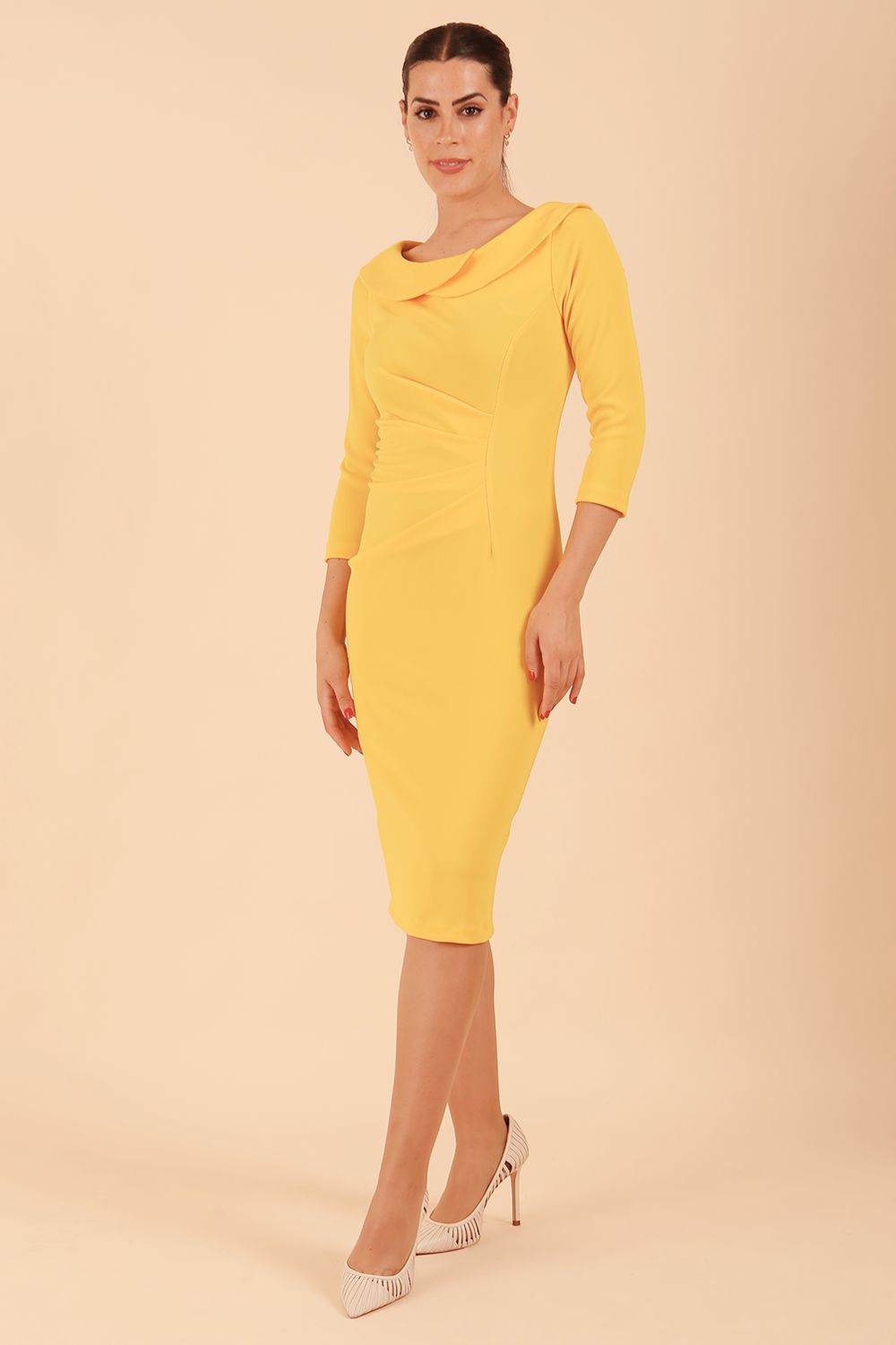 Model wearing diva catwalk Monique 3/4 Sleeve Pencil Dress with Overlapping Folded  Round Neckline and 3/4 sleeves and knee length in Sunshine Yellow front
