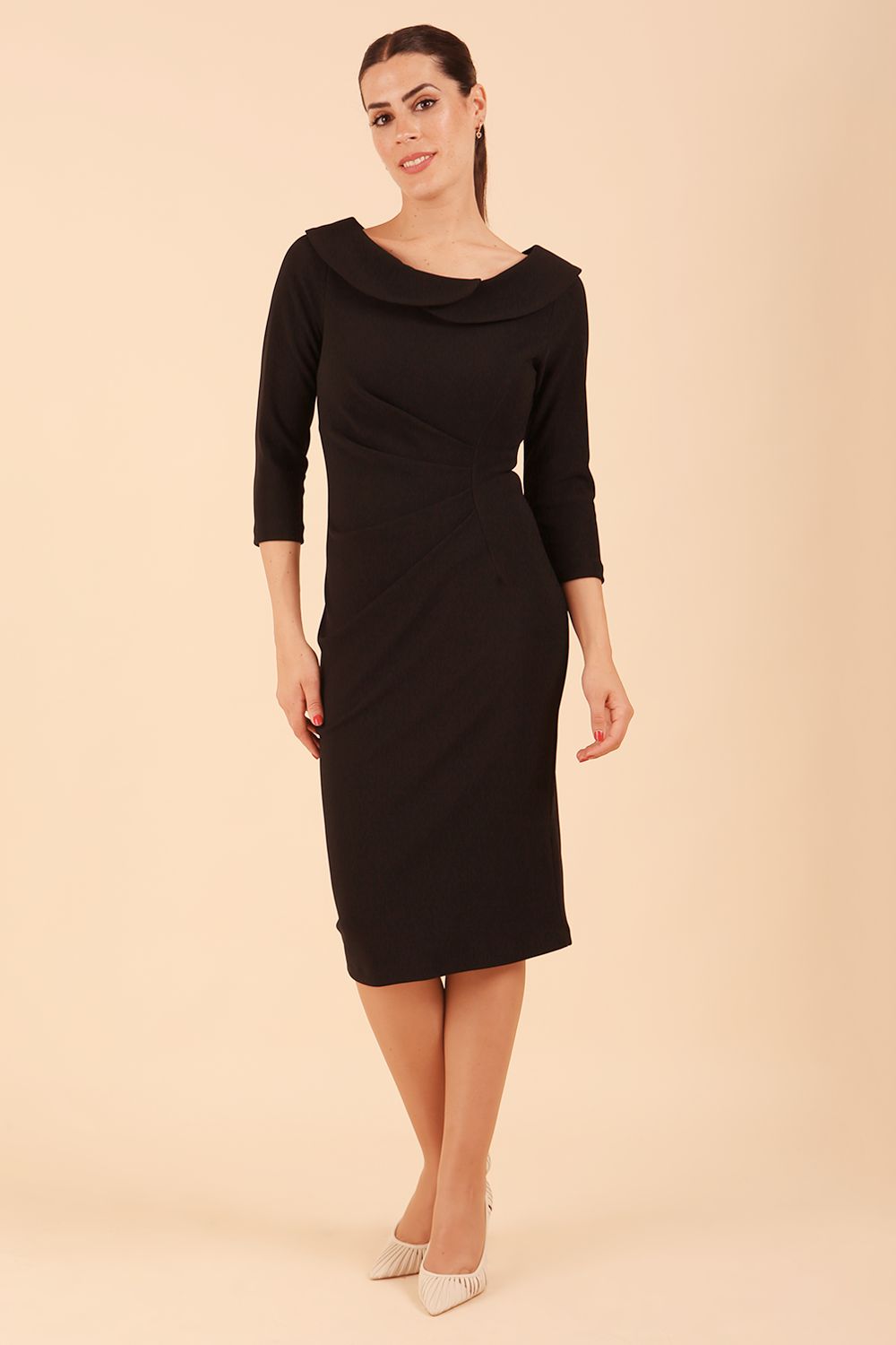 Model wearing diva catwalk Monique 3/4 Sleeve Pencil Dress with Overlapping Folded Round Neckline and 3/4 sleeves and knee length in Black front