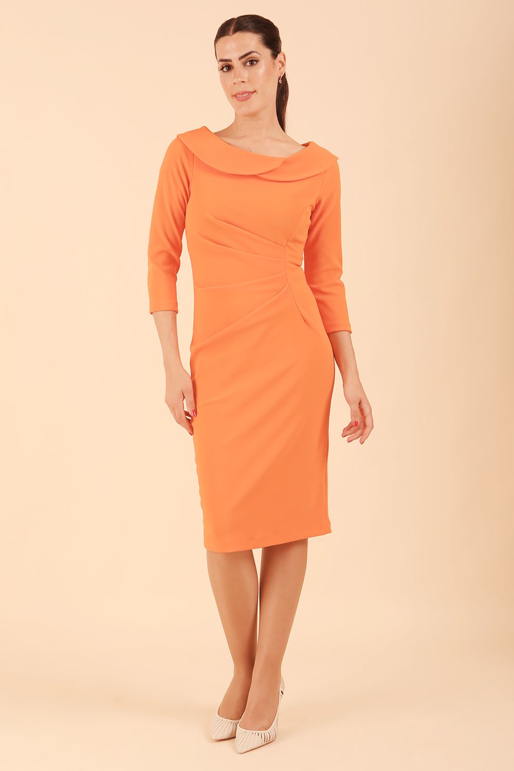 Model wearing diva catwalk Monique 3/4 Sleeve Pencil Dress with Overlapping Folded Round Neckline and 3/4 sleeves and knee length in Golden Poppy front