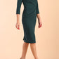 Model wearing diva catwalk Monique 3/4 Sleeve Pencil Dress with Overlapping Folded  Round Neckline and 3/4 sleeves and knee length in Green Gables side