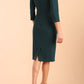 Model wearing diva catwalk Monique 3/4 Sleeve Pencil Dress with Overlapping Folded  Round Neckline and 3/4 sleeves and knee length in Green Gables side